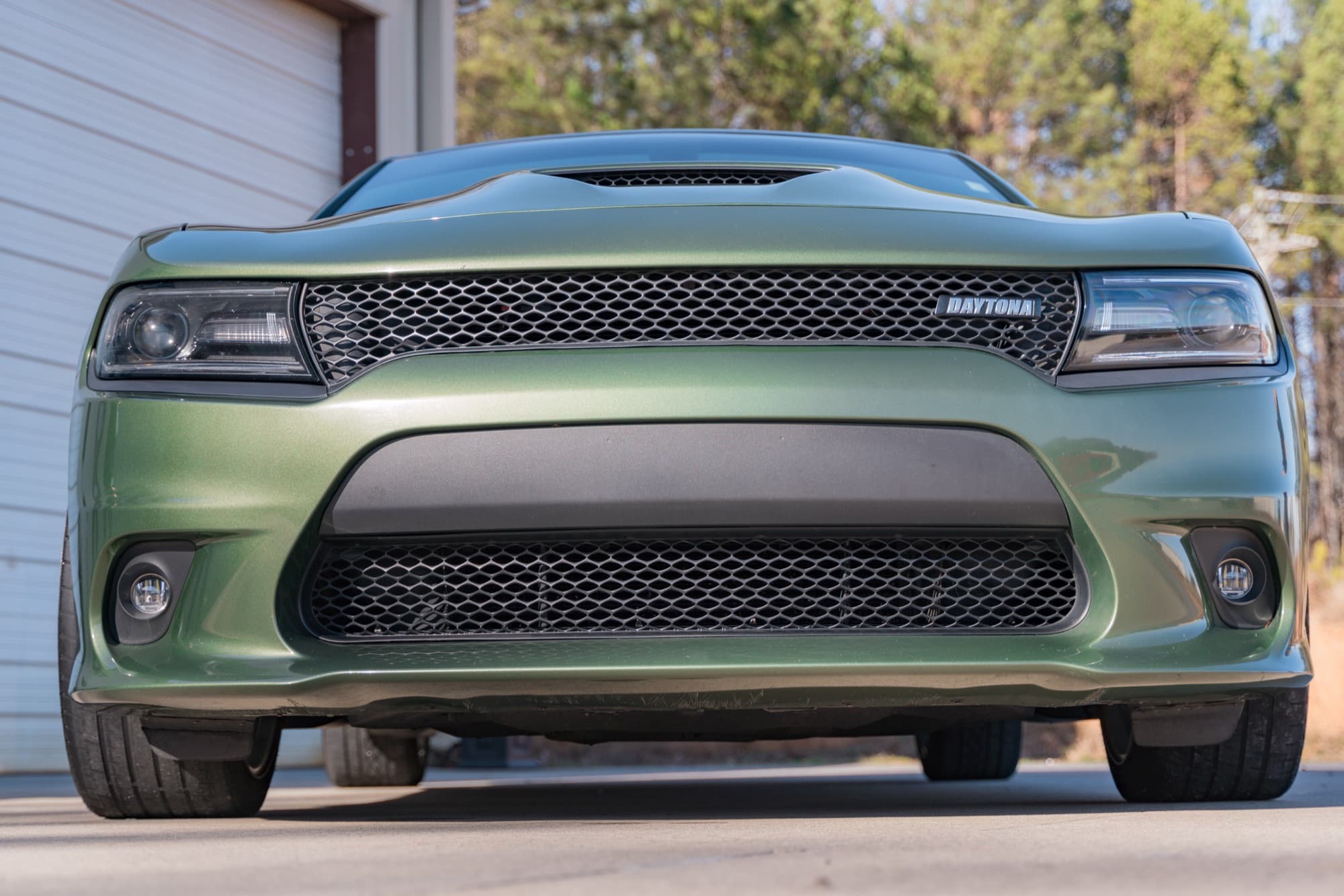 The front bumper, grille and hood of a Dodge Charger