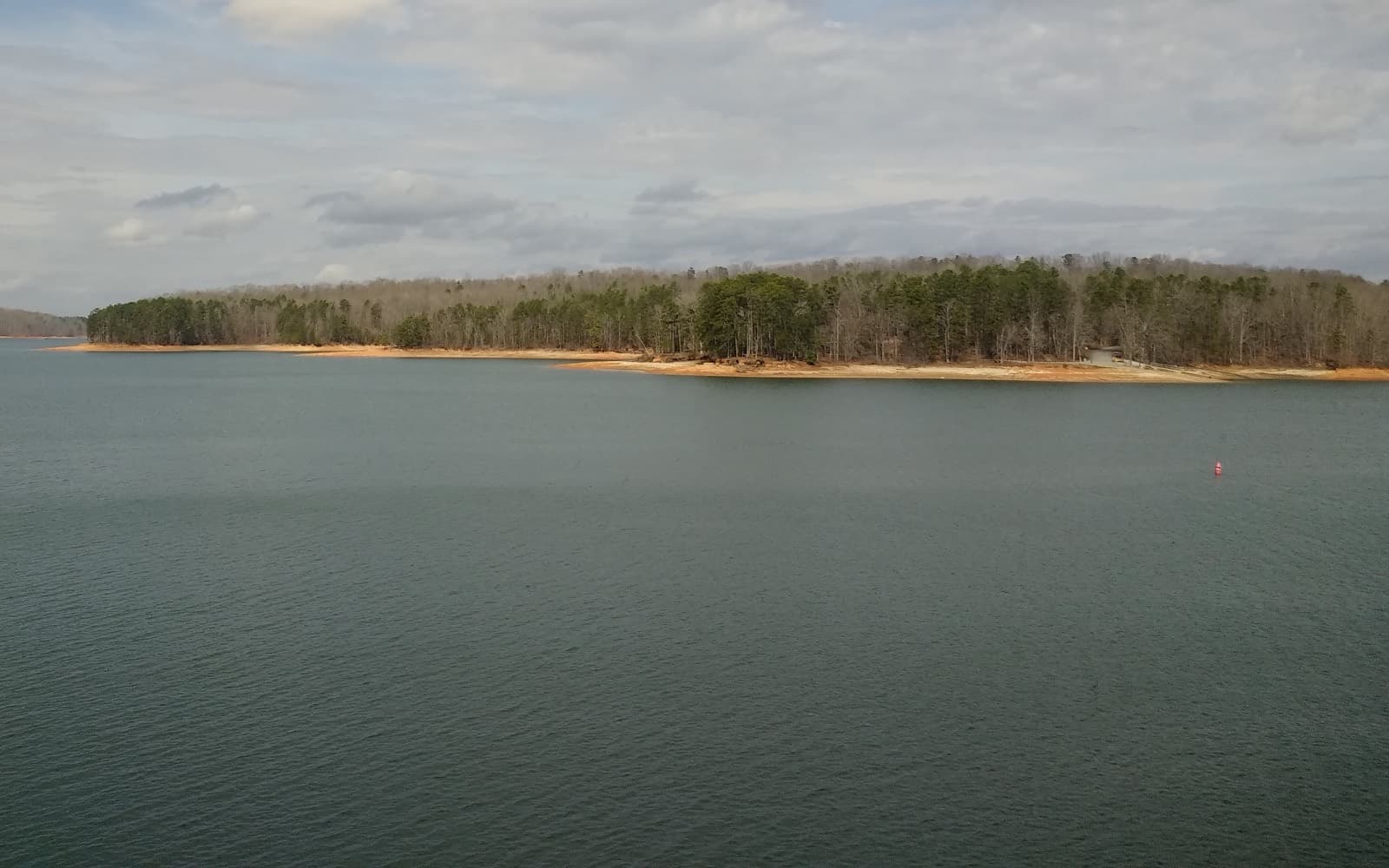 Calm open water and a wooded shoreline at Lake Hartwell State Park