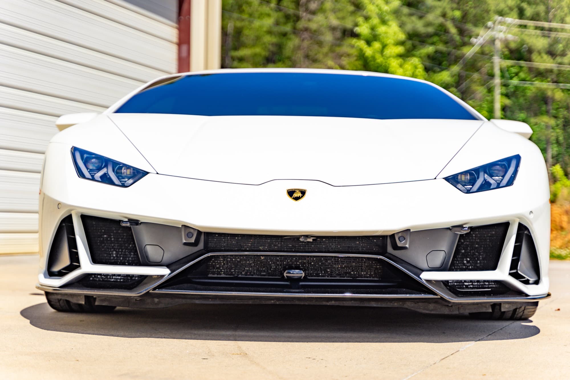 Front view of a Lamborghini with sharp bumper and hood lines