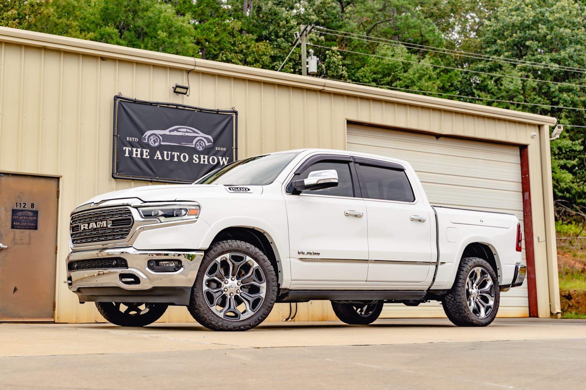 A white Ram pickup truck parked outside